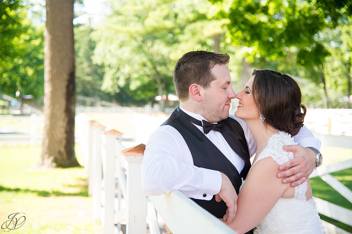 romantic photo of bride and groom at saratoga racetrack