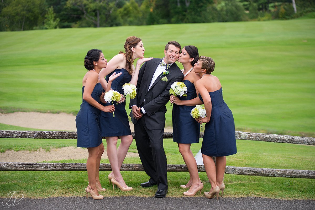 bridesmaids blowing kisses at the groom
