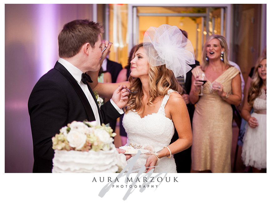 Jessica and Chad cut the cake at their stunning Mint Museum wedding. © Aura Marzouk Photography, Greensboro Wedding Photographer