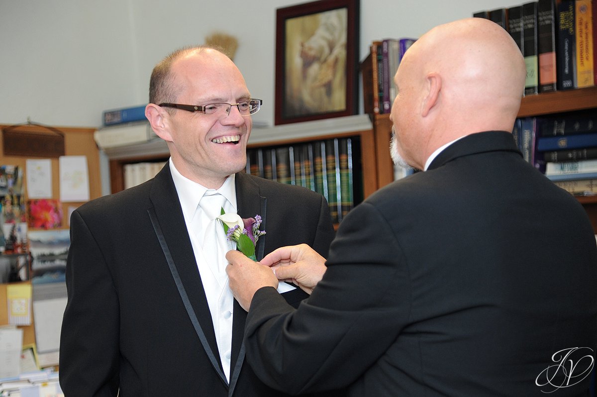 best man and groom, final touches and wedding dress, wedding flower photo, Wedding at The Queensbury Hotel, Lake George Wedding Photographer