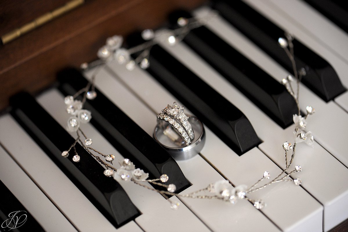 photo of wedding rings on a piano