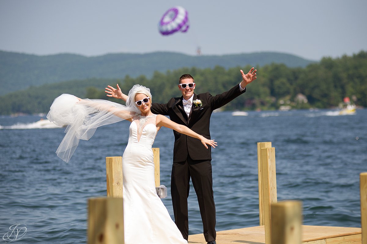 fun bride and groom photo on dock on lake lake george