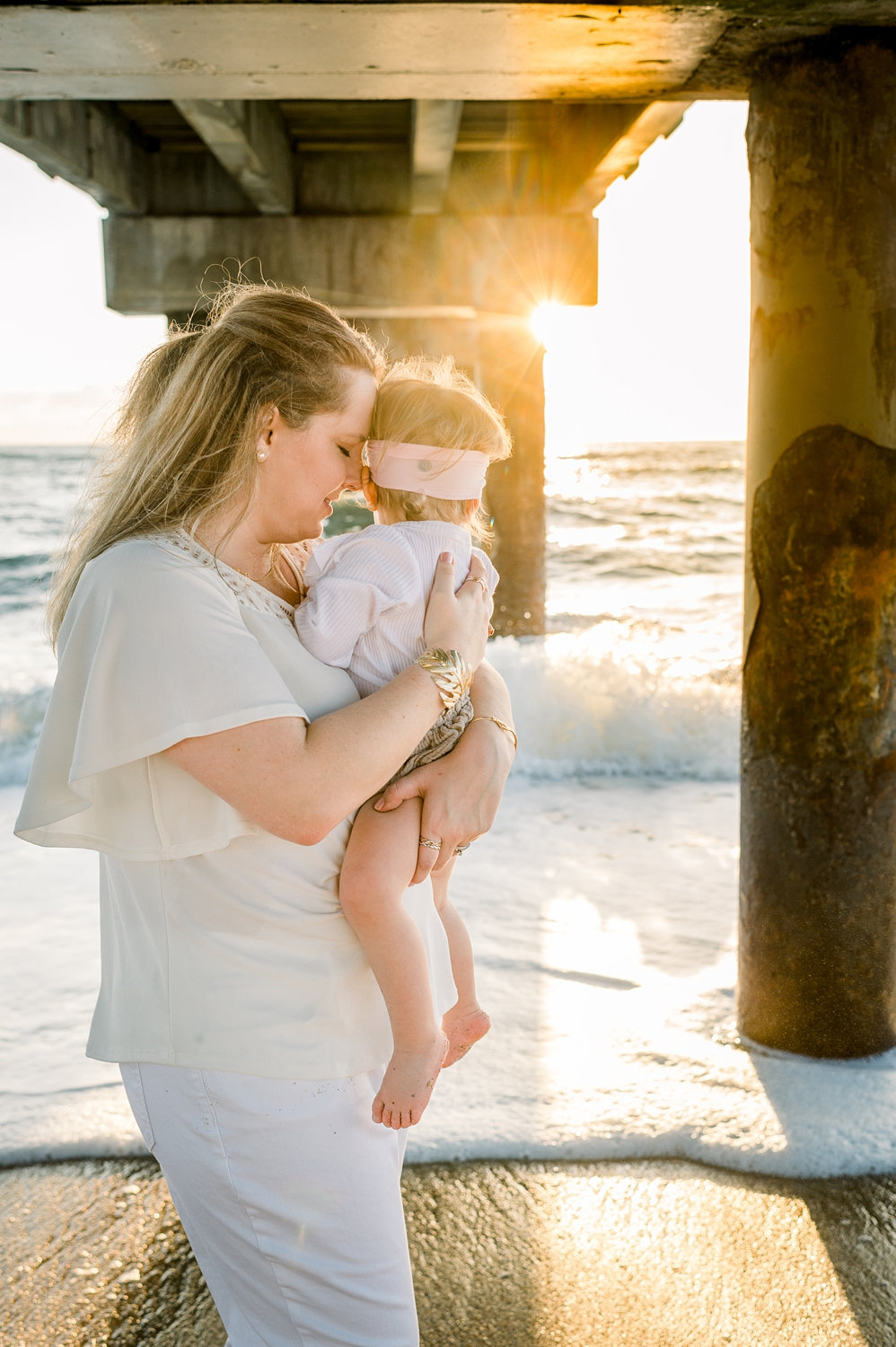 mother cradling daughter, pier photography, Saint Augustine Beach, Florida, Ryaphotos