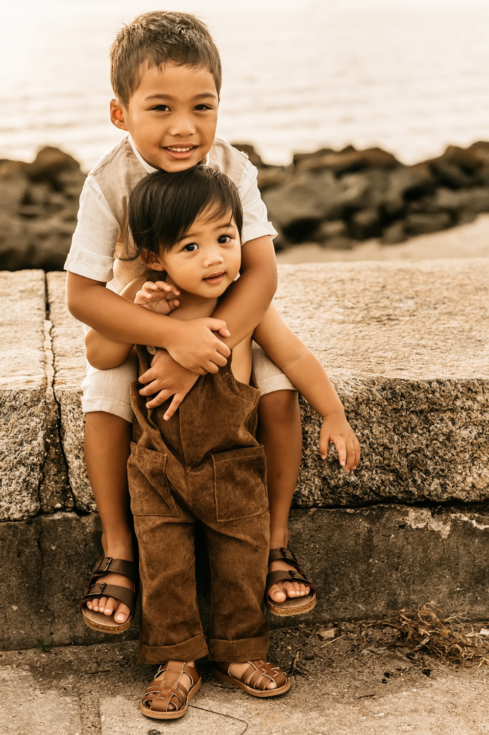 two young brothers wearing neutral colors and brown sandals, Saint Augustine family photographer