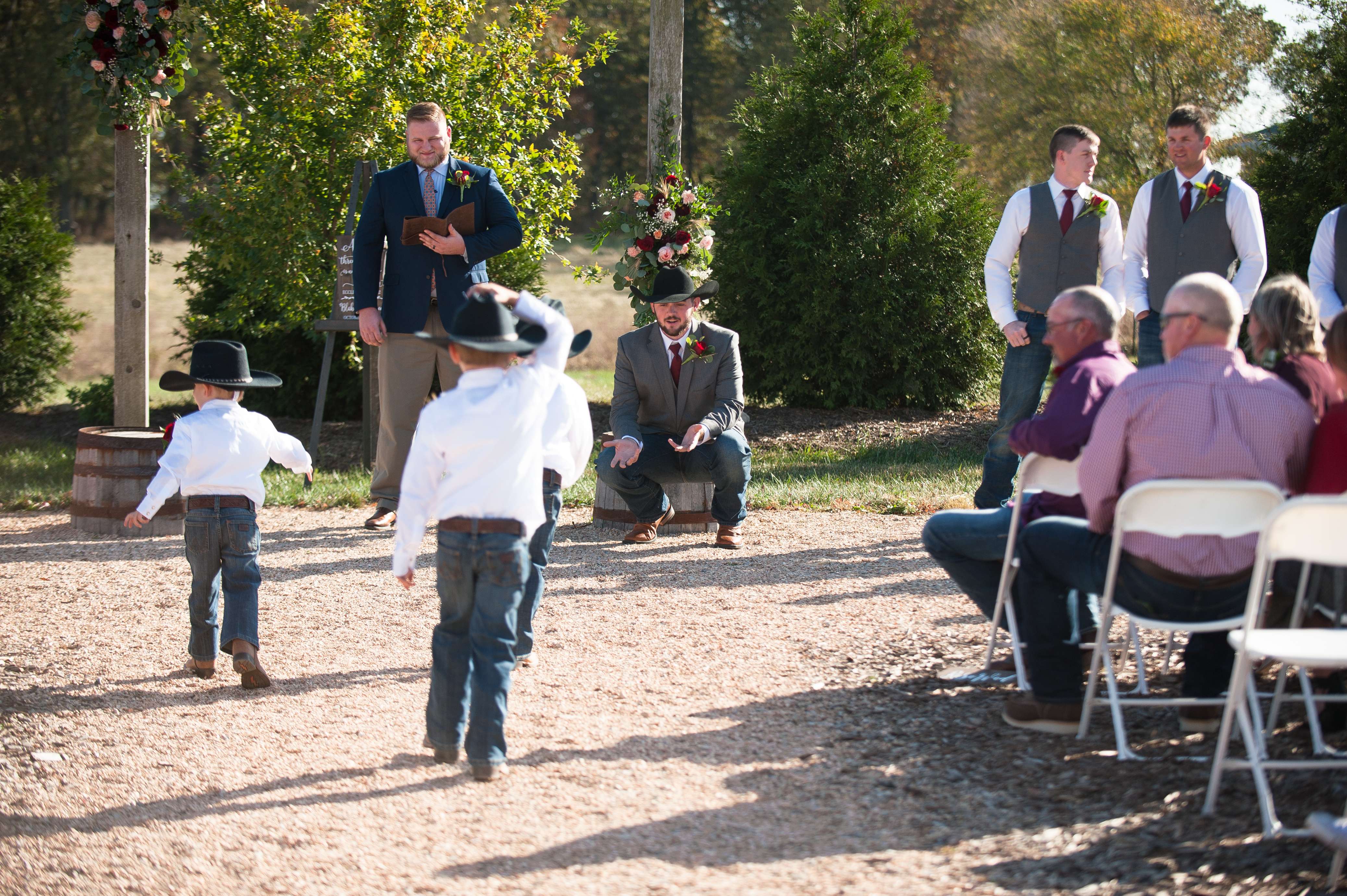 Ringbearers running down the aisle to see the groom.