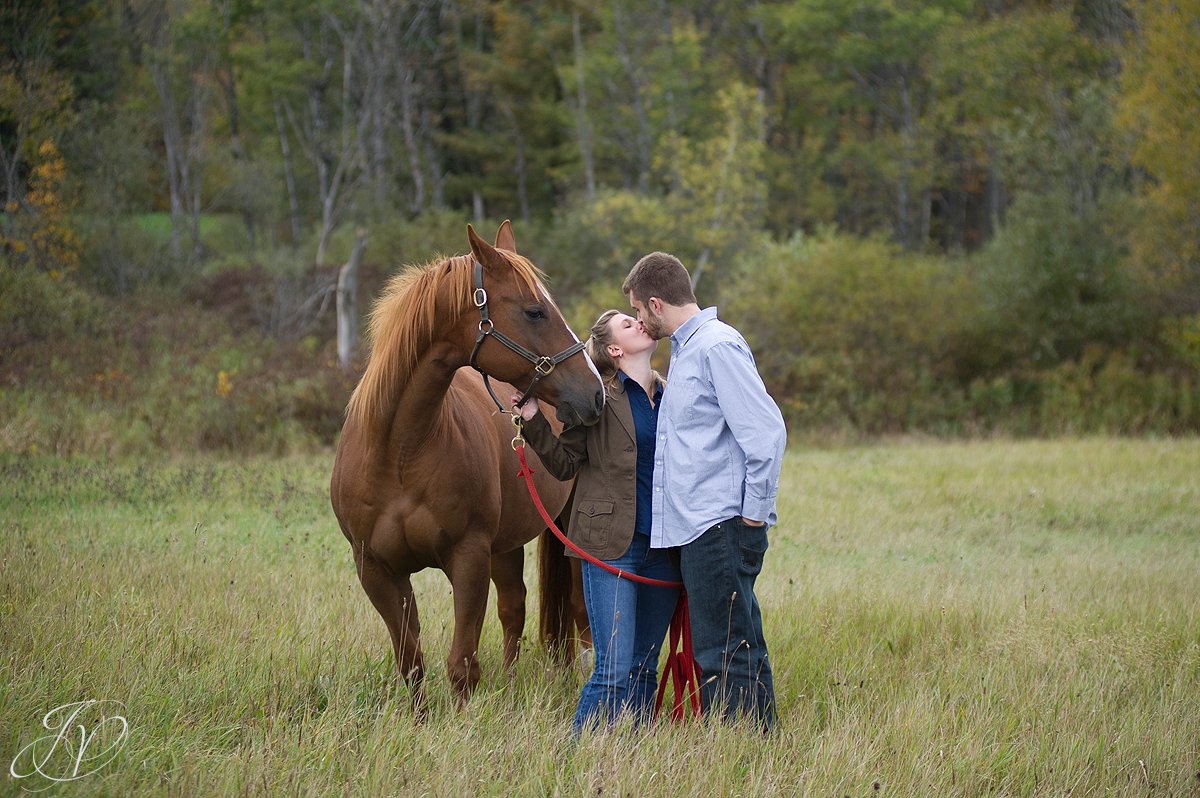 Saratoga Springs Engagement Photographer, Albany Engagement photography, Newly engaged photos, Saratoga portrait photographer, couple kissing with horse