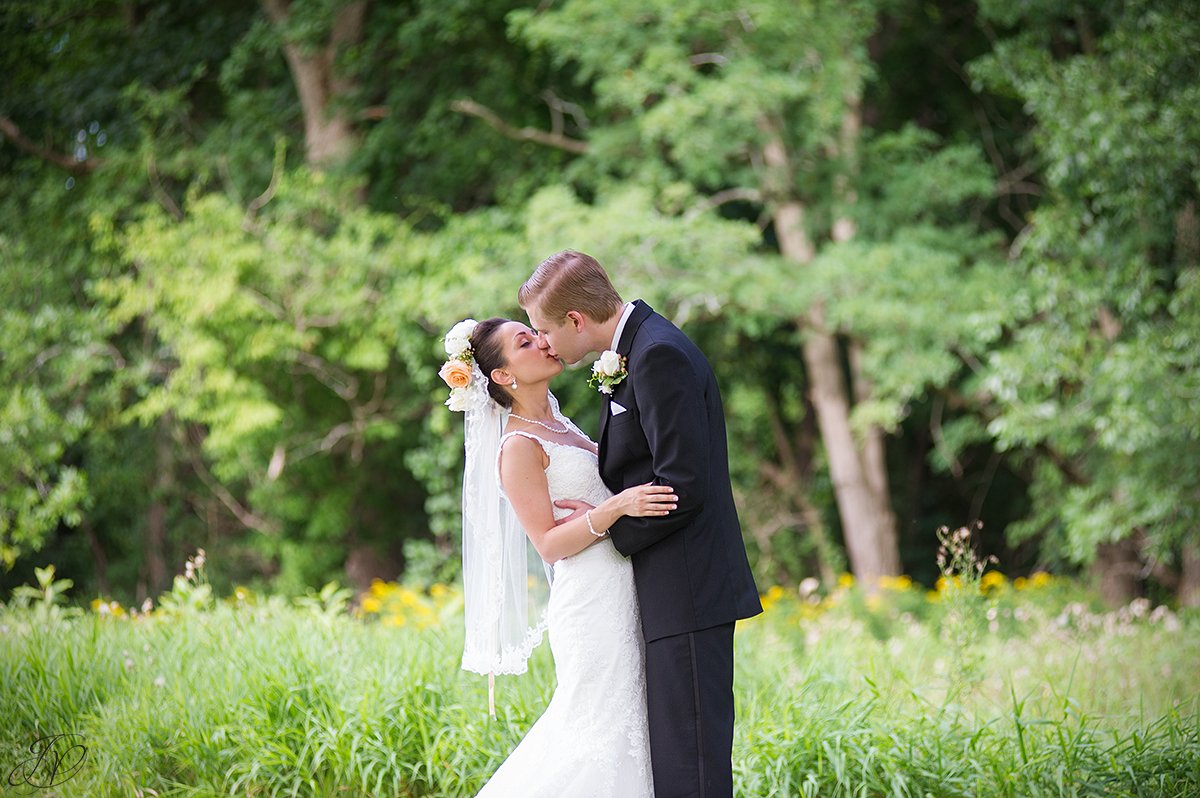 bride and groom kissing normanside country club
