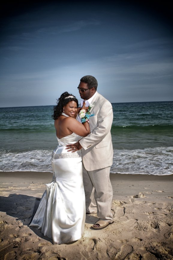 Wedding couple embracing on a beach