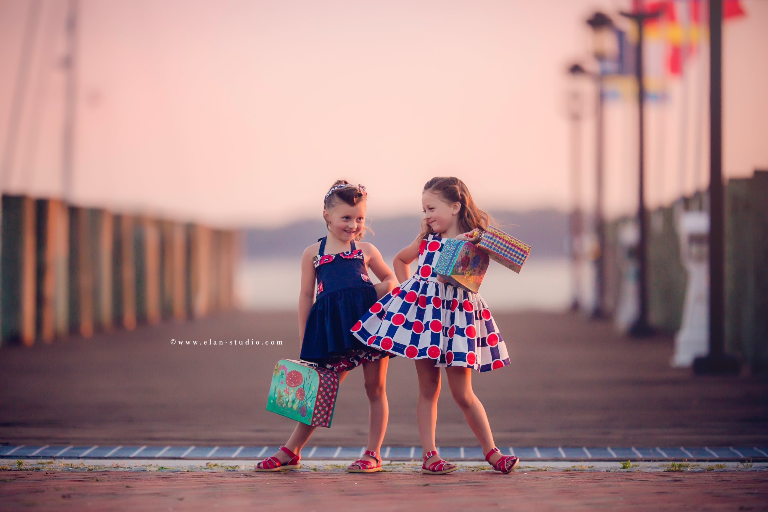 vintage beach photoshoot, two sisters, victory rolls hair, vintage girls dresses