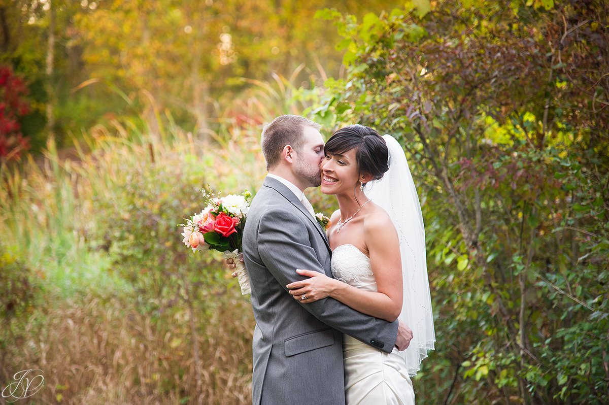 beautiful image of bride and groom in the fall