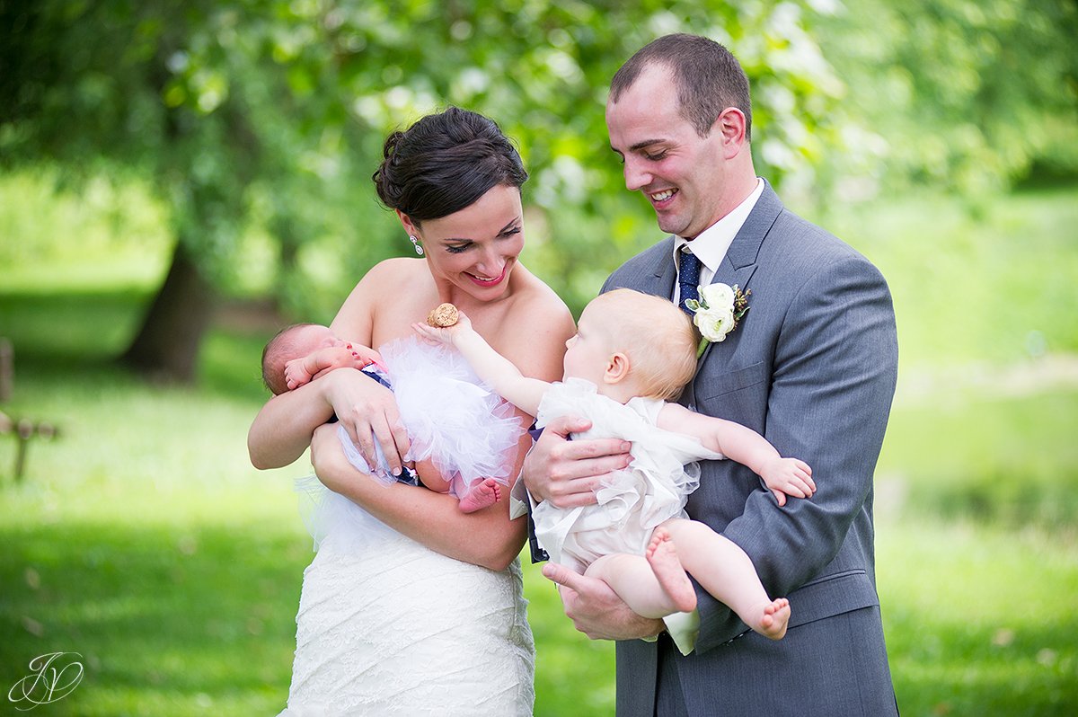cute shot of bride and groom with baby nieces