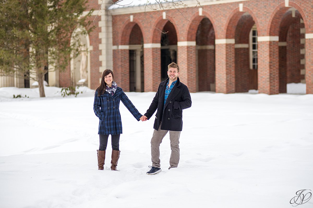 photo of engaged couple holding hands