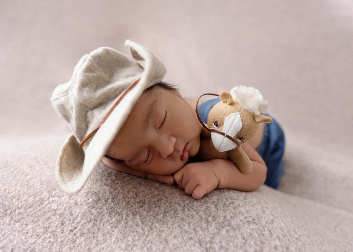 Newborn baby boy with stuffed animal - Andrea Ruff Studios Orlando