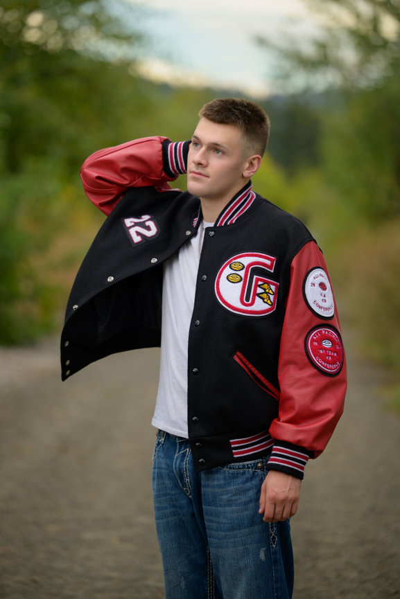 senior guy wearing a Glencoe High School letter jacket