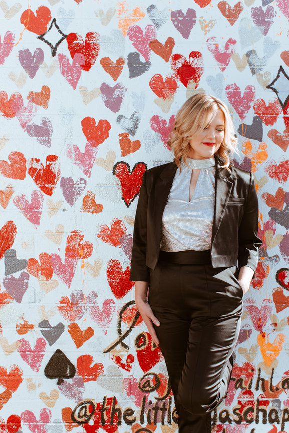Styled portrait of Janel downtwon and with art mural of hearts and natural light, portrait picture taken by Adam Trujillo, a Las Vegas portrait photographer.
