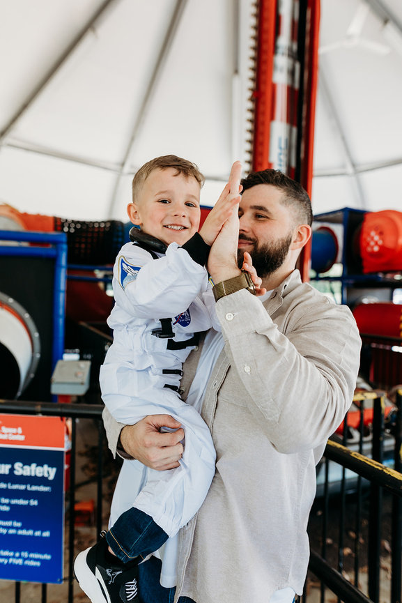 Huntsville rocket city father holding son in lifestyle photography