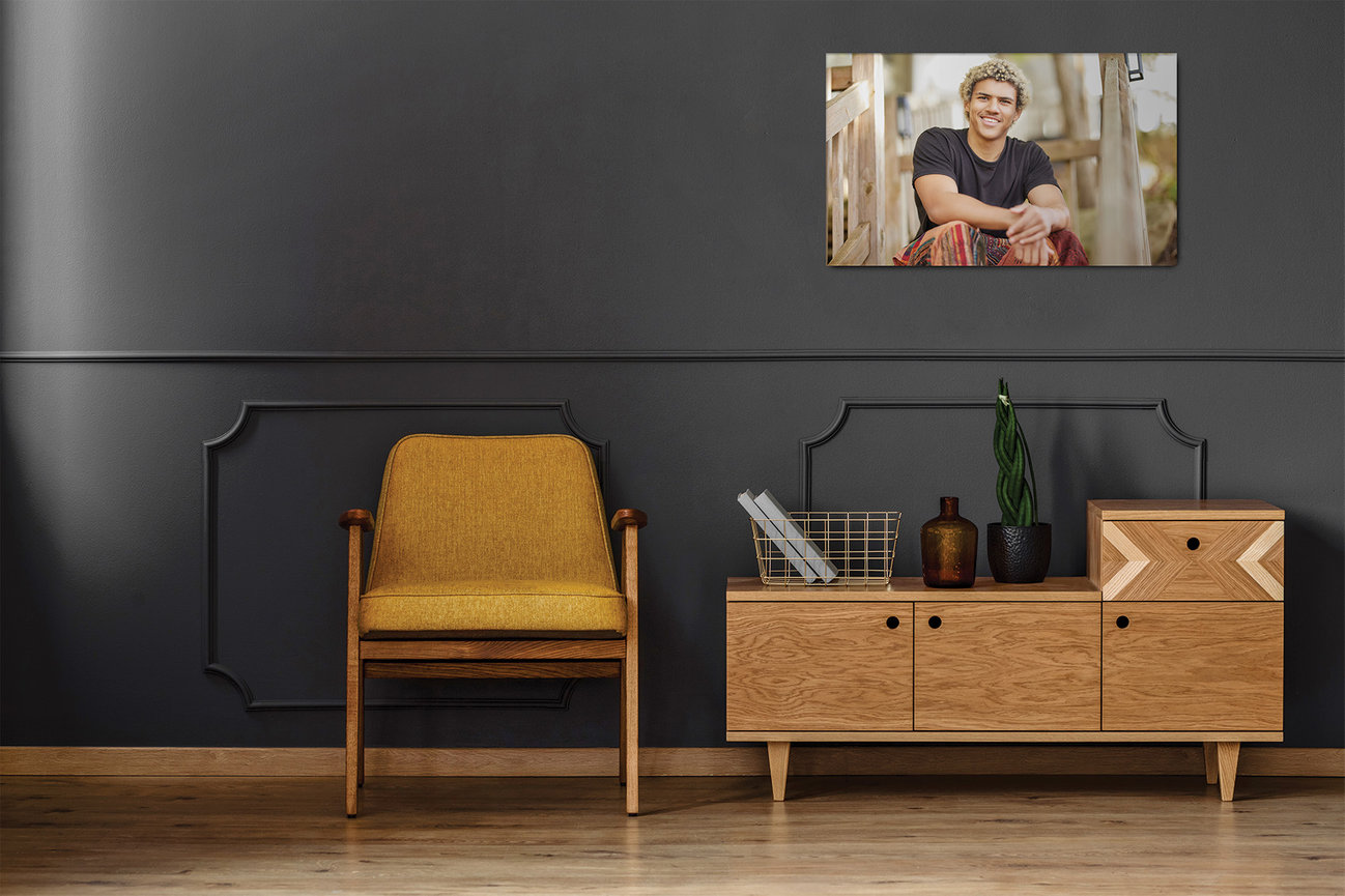 High school senior portrait displayed as statement wall art in a modern home, showing how portraits are designed to be enjoyed as part of everyday living