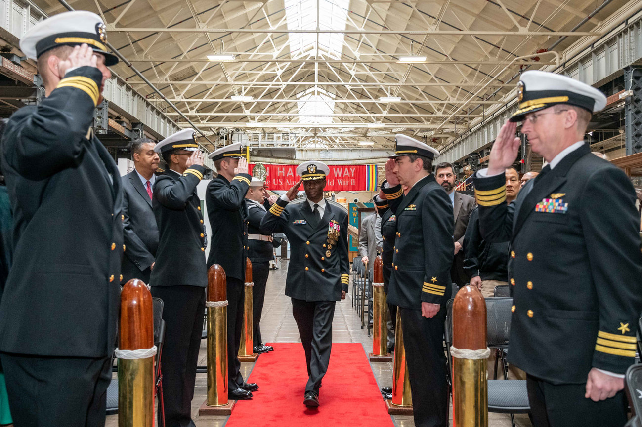 Naval Officer saluting during his arrival as the official party at his retirement ceremony