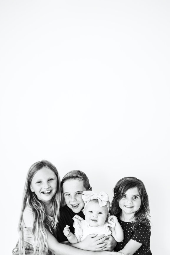 Young girl with golden hair and big brown eyes looking straight in to the camera