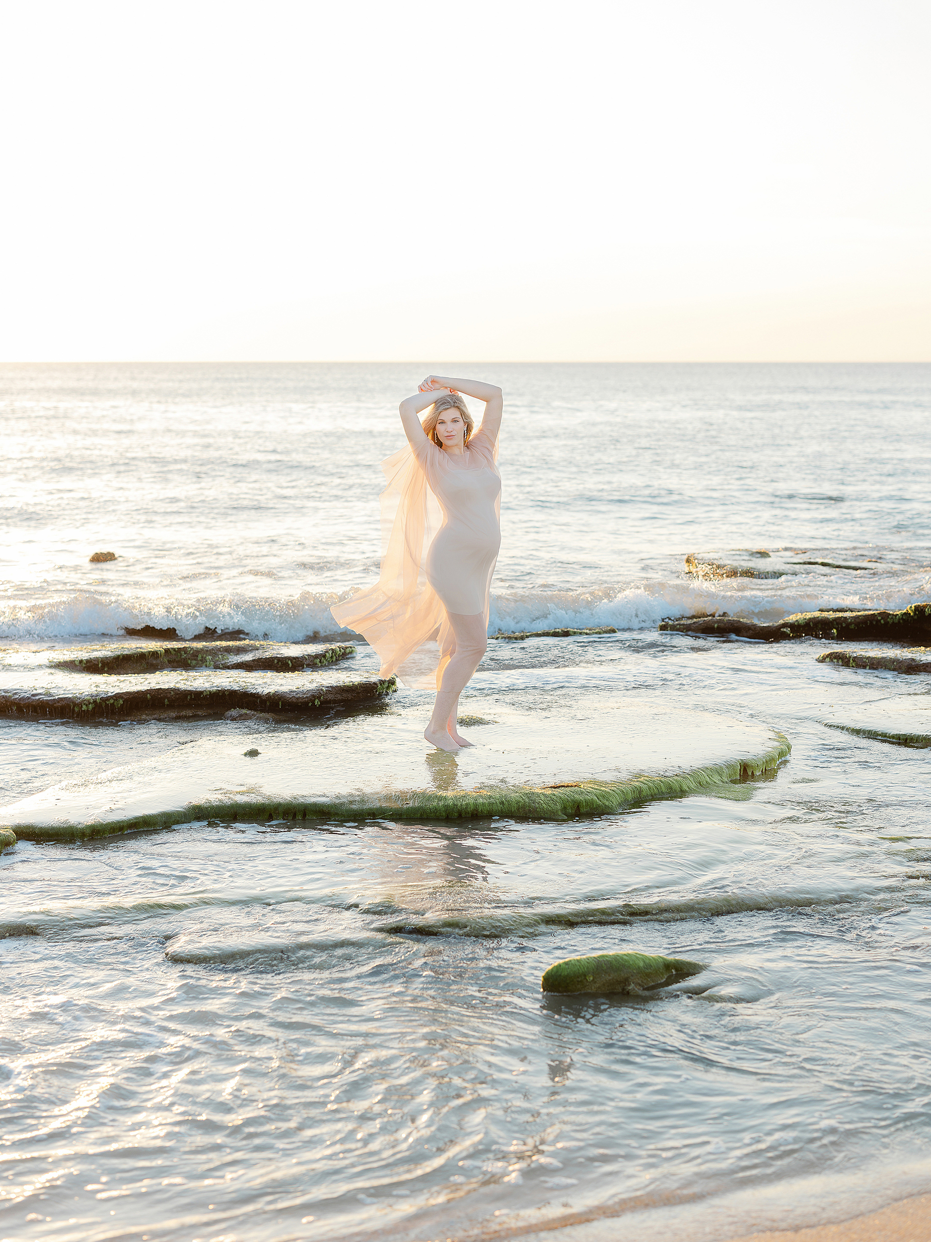 A light and airy maternity portrait at sunrise in St. Augustine Beach.