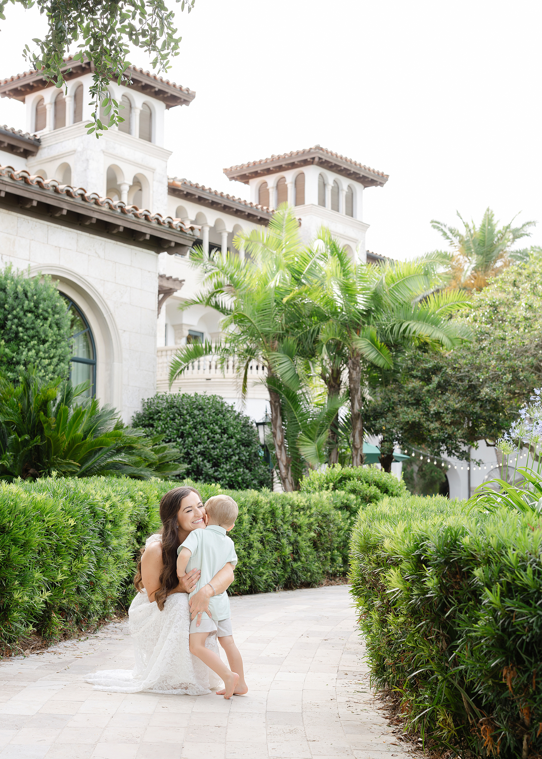 A woman and her son hug each other on the grounds of the resort at The Cloister, Sea Island, GA.