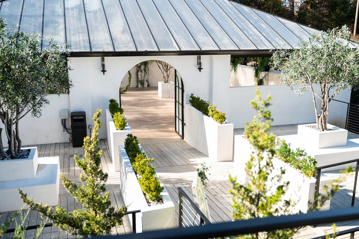 Ceremony space at Greenhouse Two Rivers with arched entryway and open windows