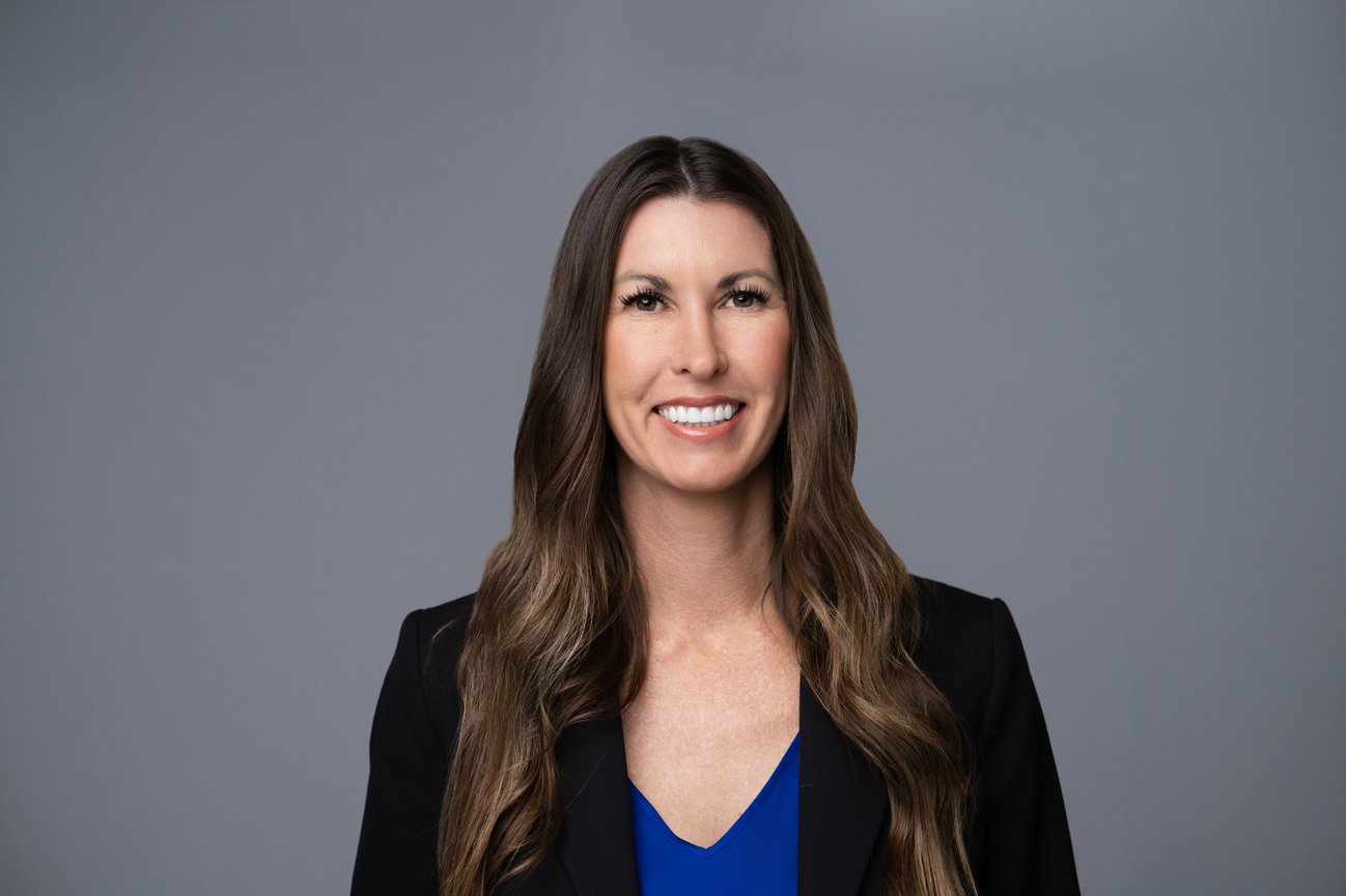 Executive-style professional headshot with studio lighting used for LinkedIn and corporate branding
