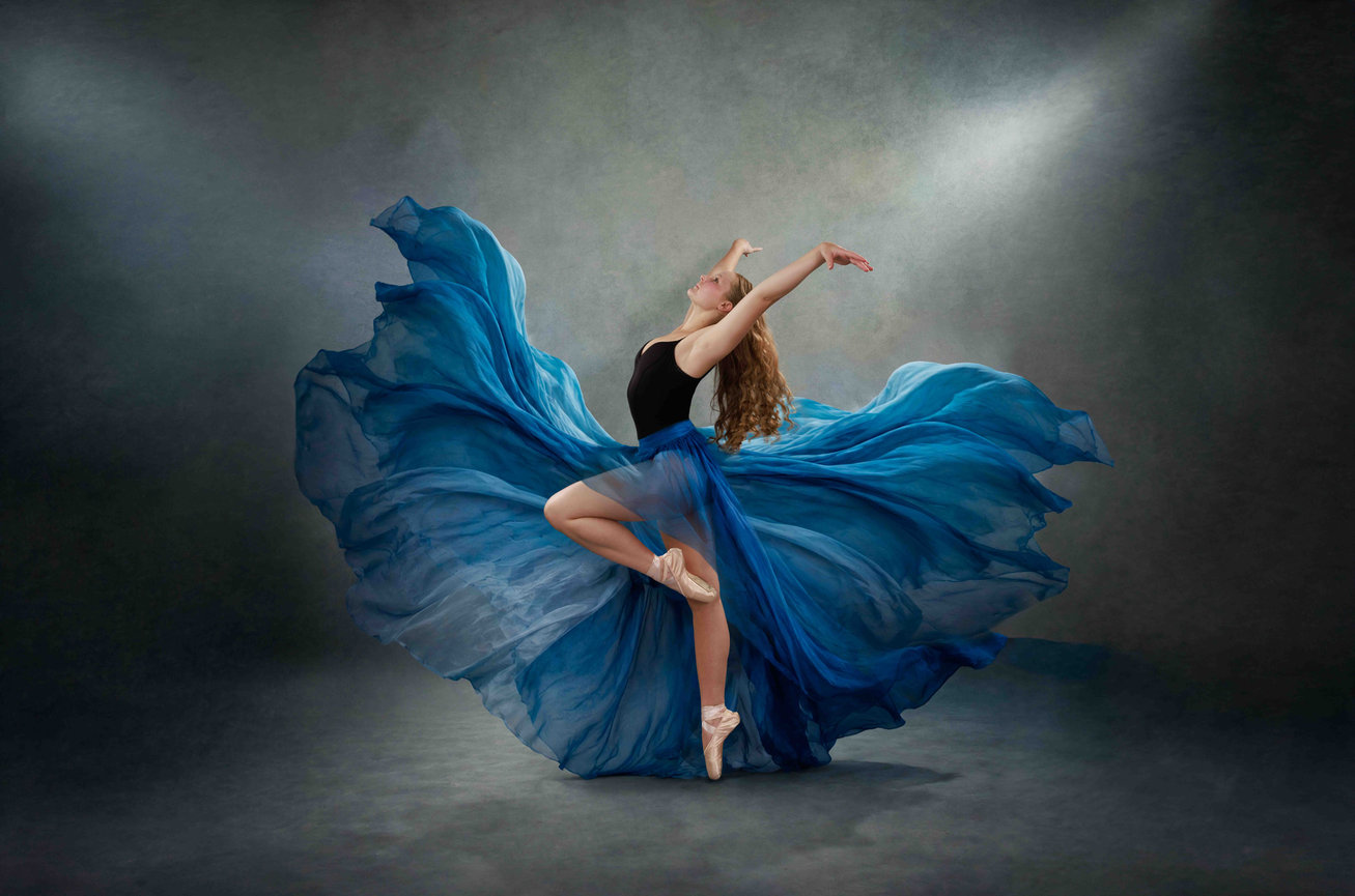 Dancer in flowing blue skirt fabric Storybook Images