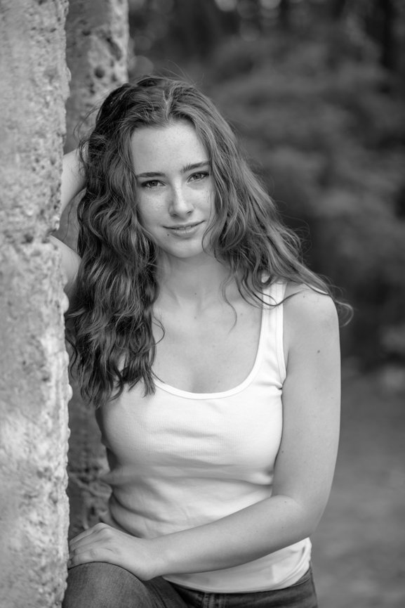 Black and white photo of senior year girl in tank top and jeans. Eagle, Idaho