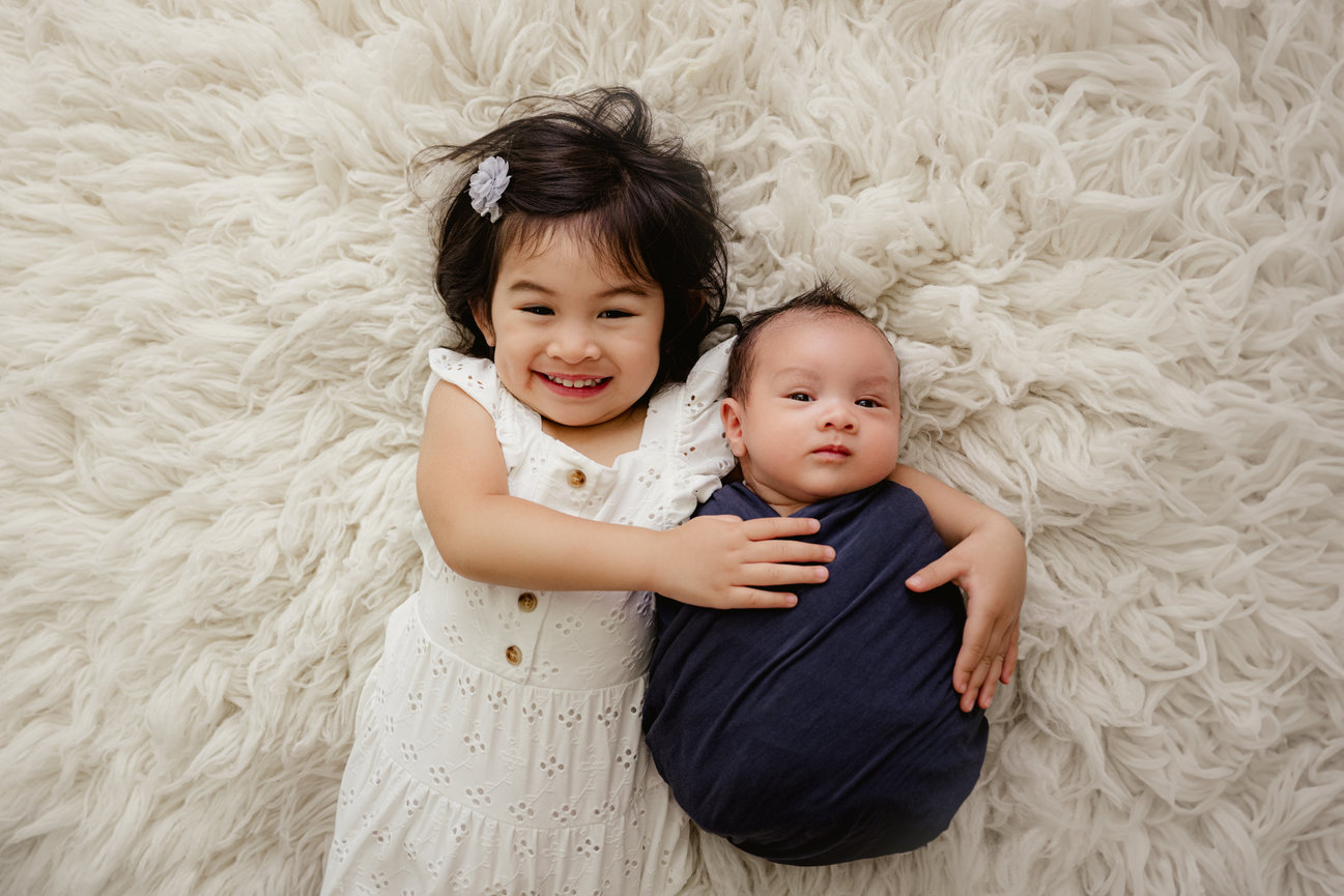 Learn about baby-led newborn photography in Houston, Texas with a relaxed experience designed for parents and baby.