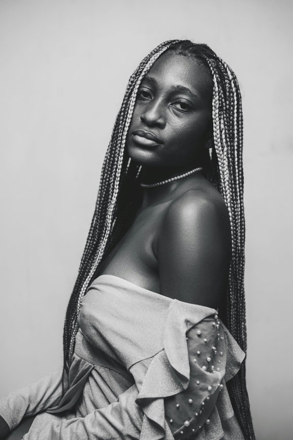 Woman with long braids looking away