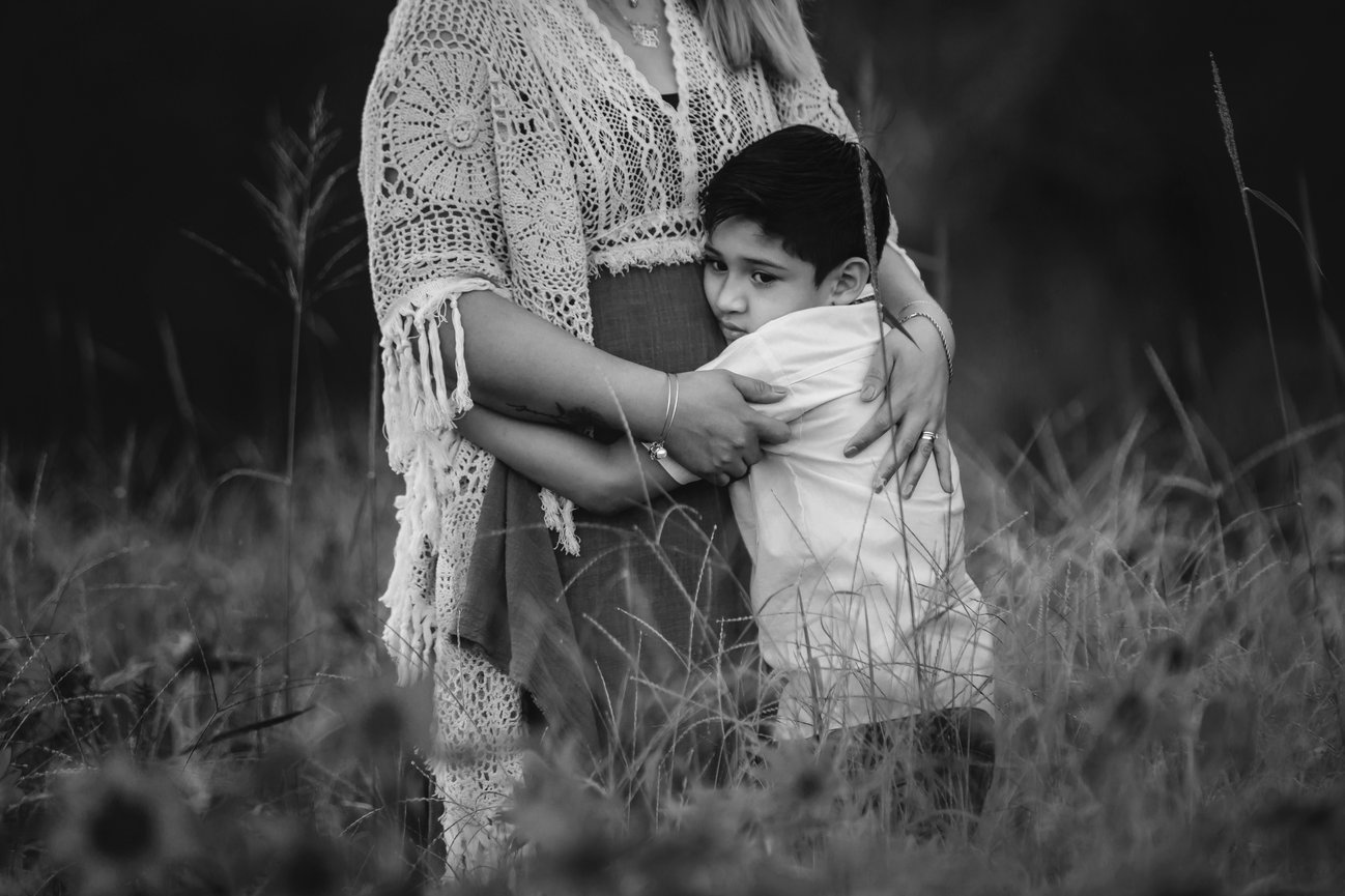 Mom embraces son in touching photo after father's death.