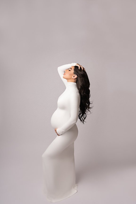 Elegant maternity portrait in studio with white silk gown, Manasquan NJ