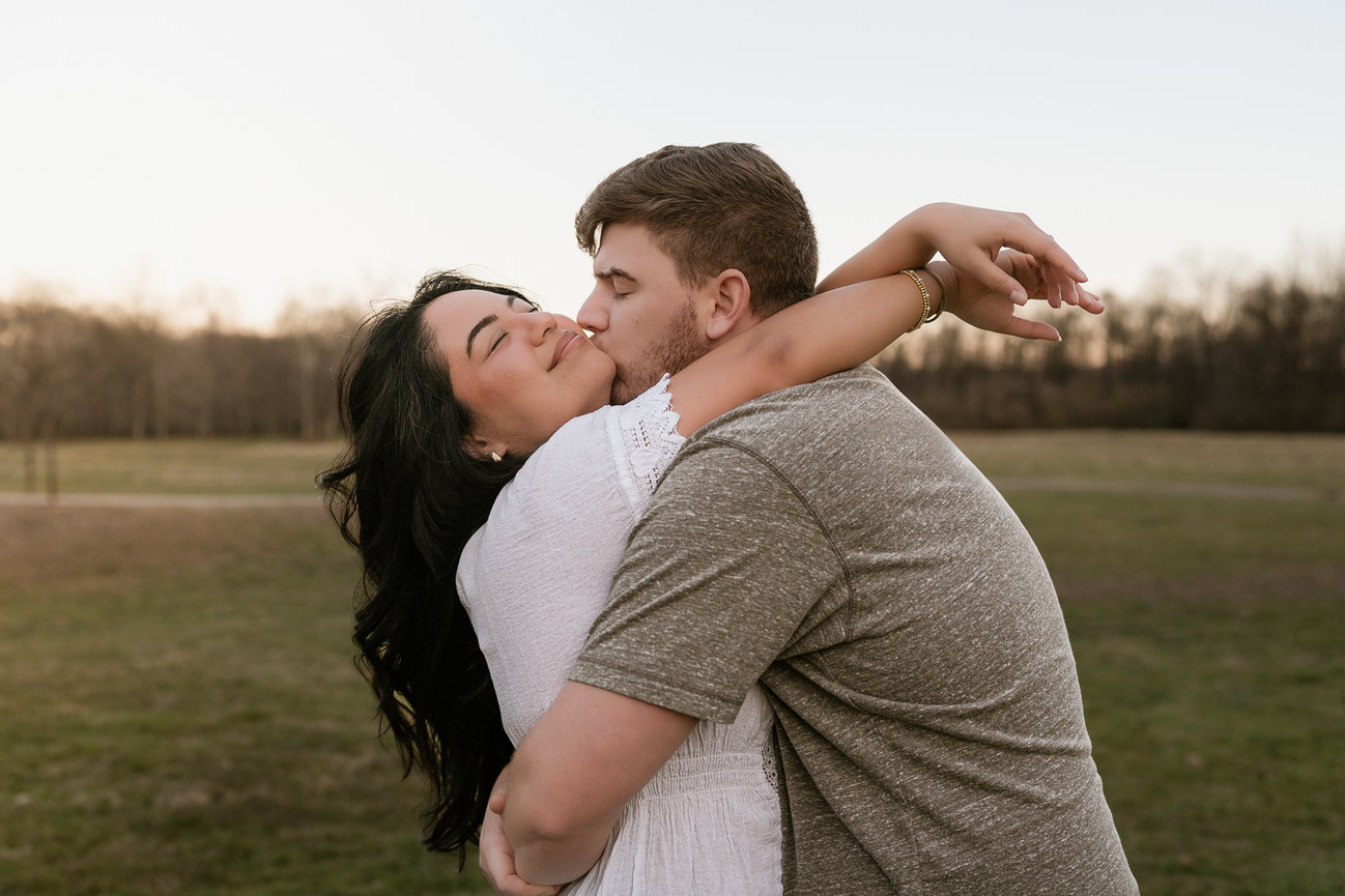 Couple embracing in a meadow