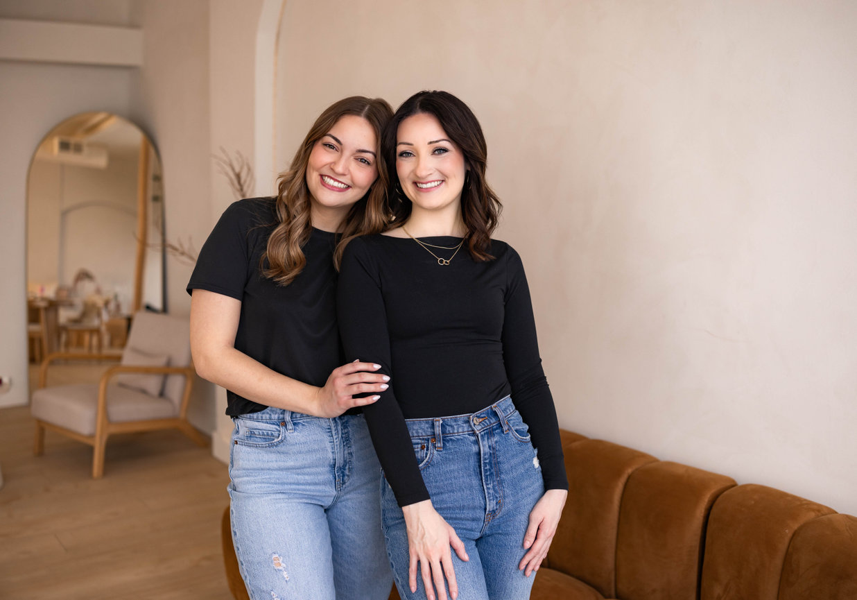 Professional business headshot of smiling woman in studio with neutral background