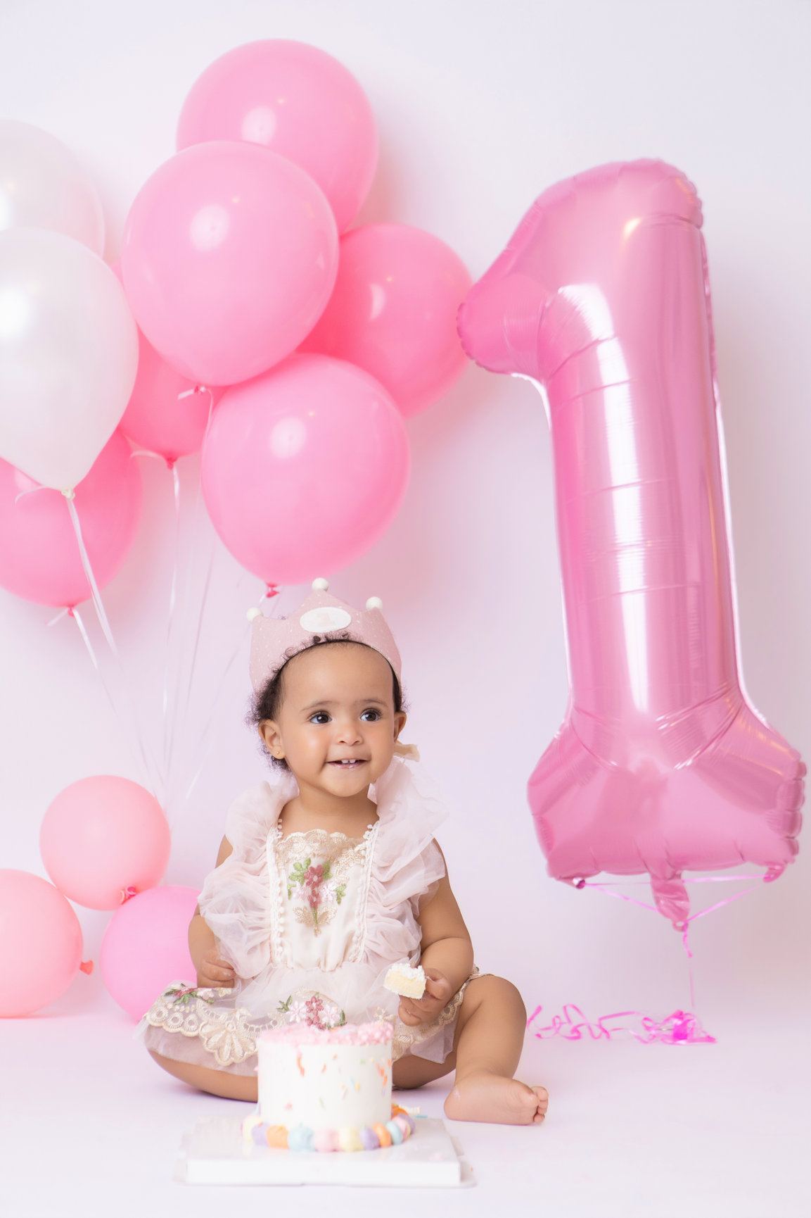 Calgary cake smash photography pink balloons tulle and bubbles first birthday session photo 18