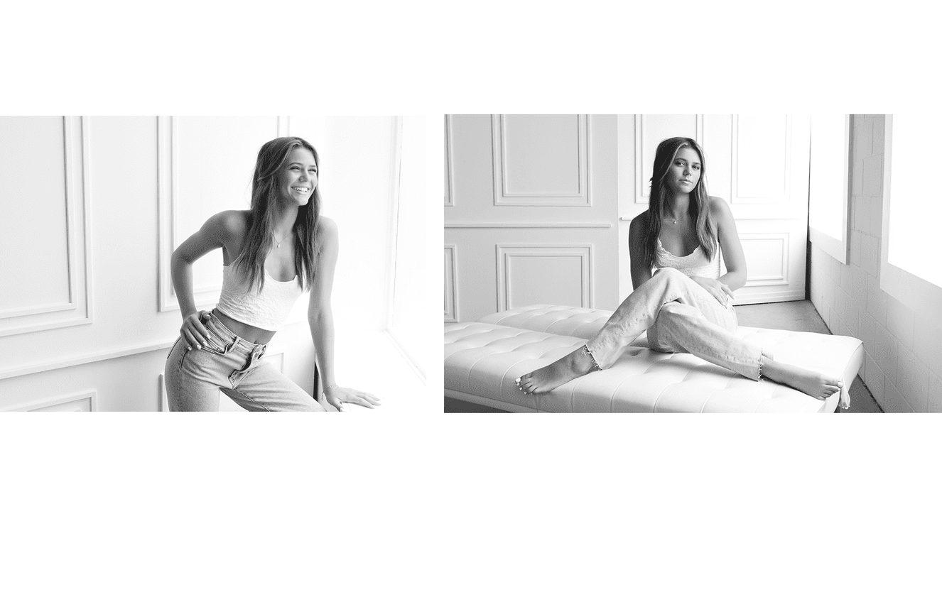 Gracie wearing her favorite relaxed blue jeans and white tank top during her high school senior photo session at Kliks Photography in Cedar Rapids, Iowa.