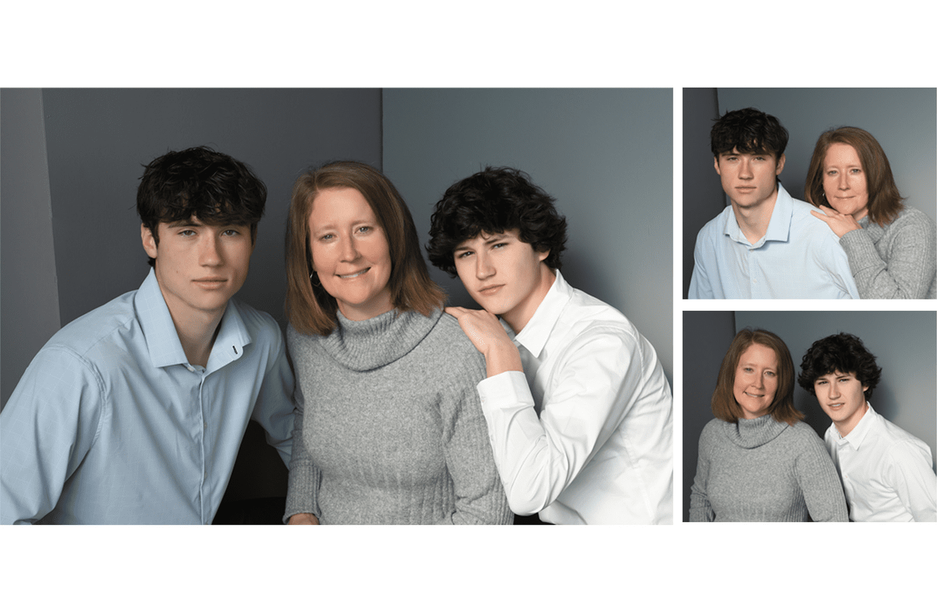 A mother with a teenaged son on either side of her leaning on her shoulders.