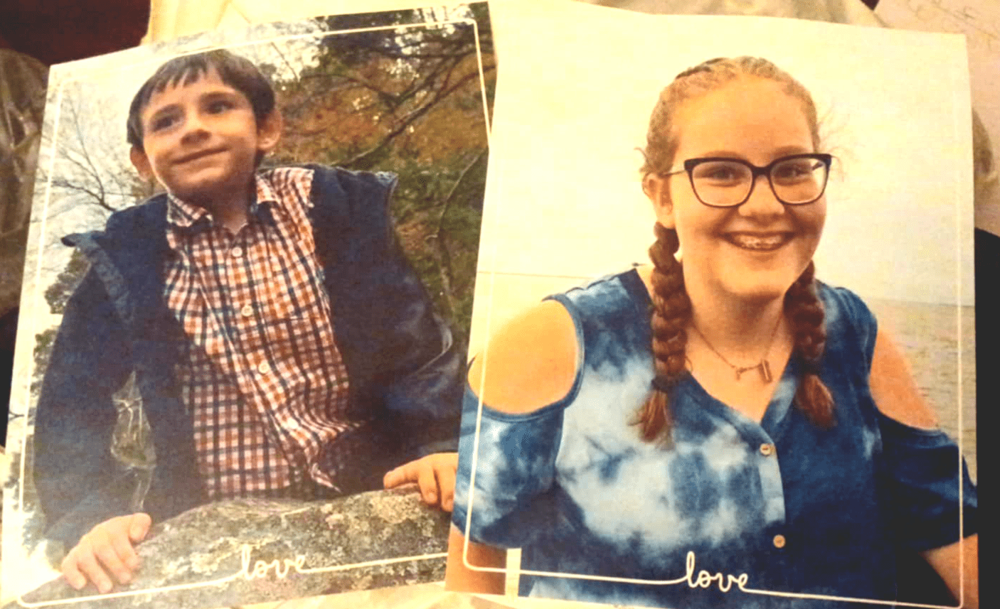 Printed photographs of a boy and a girl placed together