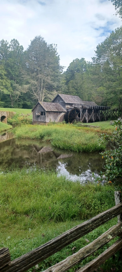 Old mill with water wheel by the river