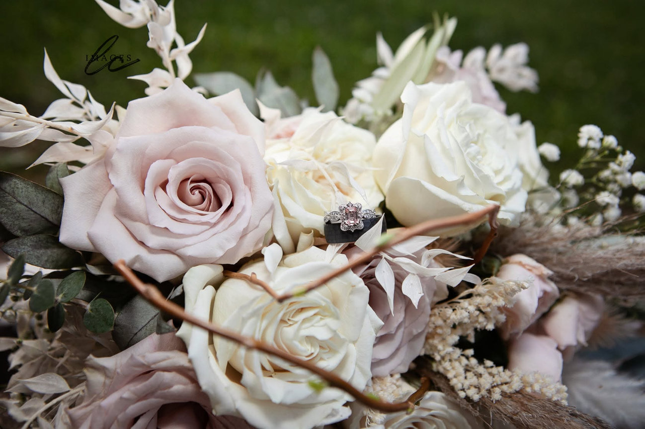 Close-up of a bridal bouquet with pale roses and white flowers